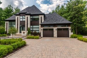 A large home with double garage doors.